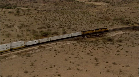 Desert Train Through Mountains Stock Footage 37304330