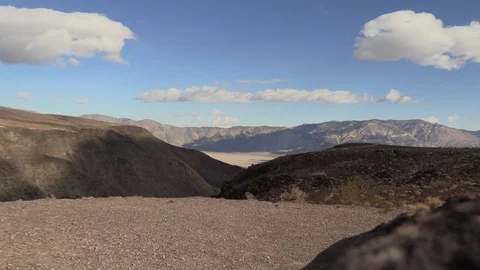 Desert Valley Mountain Zoom with clouds and blue sky Stock Footage 127207921