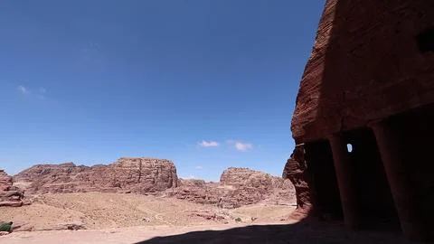 Desert Valley View Framed by Ancient Rock-Cut Monument  Stock Photos
