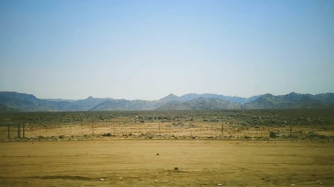 Desert view with mountain background and blue sky Stock Footage 124954199