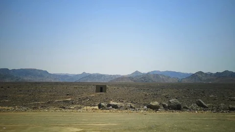 Desert view with mountain background and blue sky Stock Footage 124954345