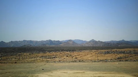 Desert view with mountain background and blue sky Stock Footage 124954497