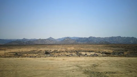 Desert view with mountain background and blue sky Stock Footage 124954639