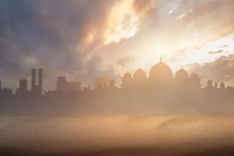 Desert with a view of a silhouette of the mosque with a dramatic sky view Stock Photos