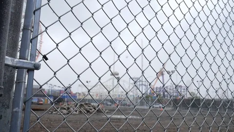 Deserted Amusement Park Grid Bars Lockdown Foggy Day Stock Footage 129581030