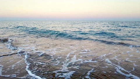 Deserted beach with a romantic sunset over the sea, camera movement Stock Footage 219274255