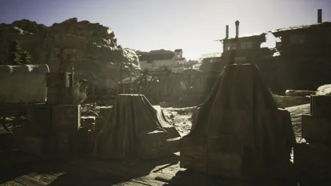 Deserted camp scene. Sunlit temporary camp in remote desert area Stock Footage 343624440