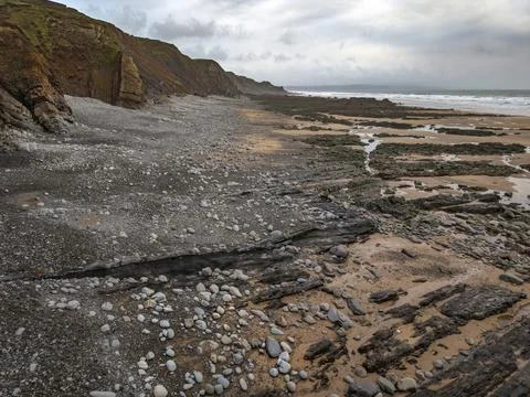 Deserted Cornish beach shaped by the Atlantic sea 스톡 사진