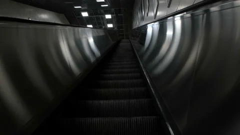 Deserted escalators going up empty of people. Normally it would be bustling Stock Footage 130407120