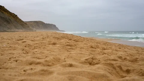 Deserted ocean beach. beach with clean sand and big waves in cloudy weather Stock Footage 116403050