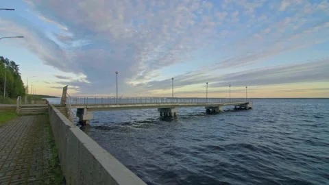 Deserted Ocean Pier Against Dramatic Sunset Clouds Stock Footage 257764914
