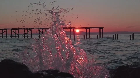 Deserted pier on a savage stranded beach in slow motion Stock Footage 216840277