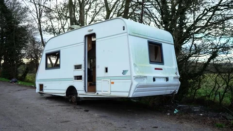 Deserted roadside caravan deteriorating under long term neglect exposure. Stock Footage 326677138