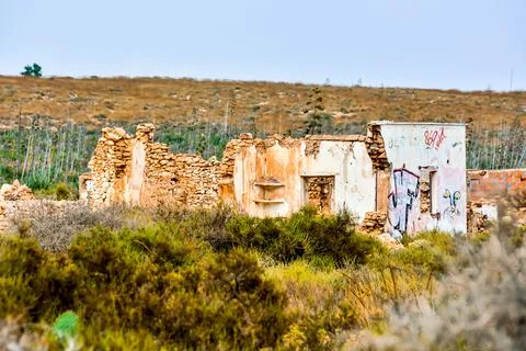 A deserted, run down building with graffiti on it Fotos de archivo