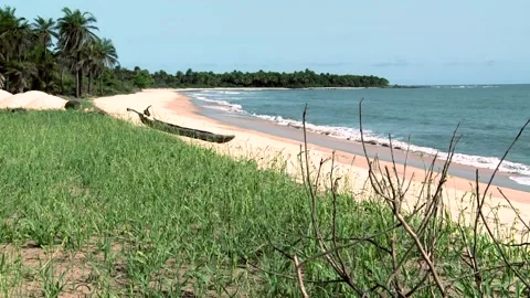 Deserted sandy beach on the Atlantic coast of Africa. Wooden boat on the sand Stock Footage 155191662