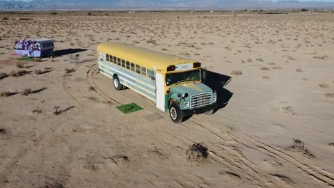 Deserted school bus. Abandoned Yellow vehicle in middle of the desert. Stock Footage 233428328