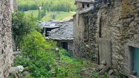 Deserted section of Simplon Dorf, Switzerland, with traditional stone houses Video stock 340948197