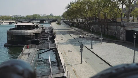 Deserted Seine River side during coronavirus lockdown crisis in Paris 4K Stock Footage 128395477