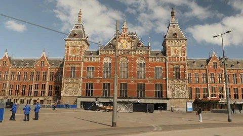 Deserted square before Central train station due to corona crisis. Amsterdam. Stock Footage 129076750
