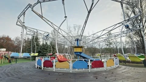 Deserted Swing Carousel at an Old Amusement Park Stock Footage 325967137