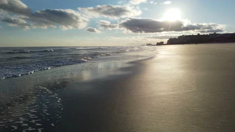 Deserted tranquil tropical beach at sunset with reflection on the wet sand Stock Footage 152887358