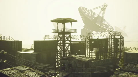 Deserted Transmission Array Near Coastline with Distant Satellite View Stock-Footage 335596159