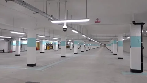 Deserted well lit and empty newly built underground car park. Stock Footage 137860790