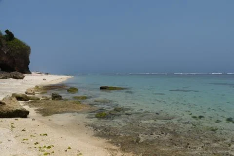 Deserted  white sand beach with rocks Foto stock