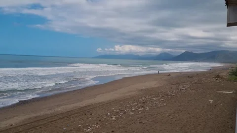 A deserted, windswept beach stretches along the Kabylie coastline in northern Stock Footage 304511658