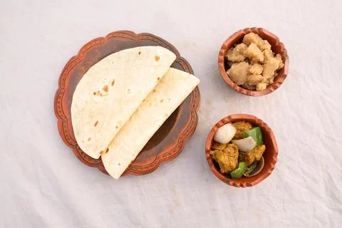 Desi breakfast Chicken korma karahi masala, Halwa and chapatti served in di.. Stock Photos