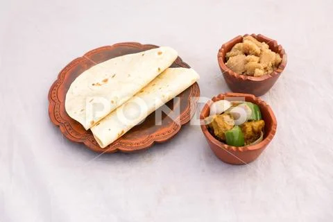 Desi breakfast Chicken korma karahi masala, Halwa and chapatti served ...