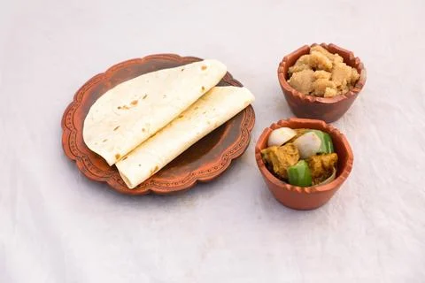 Desi breakfast Chicken korma karahi masala, Halwa and chapatti served in di.. Stock Photos
