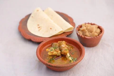 Desi breakfast Mutton nalli nihari, Halwa and chapatti served in dish isola.. Stock Photos