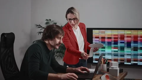 Design and architecture studio. A man and a woman are designers working with Stock Footage 294161978