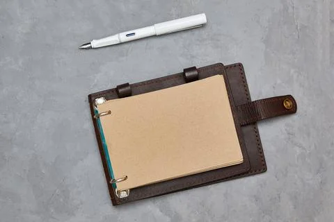 Design concept - Top view open notebook with kraft paper in a leather cover Stock Photos