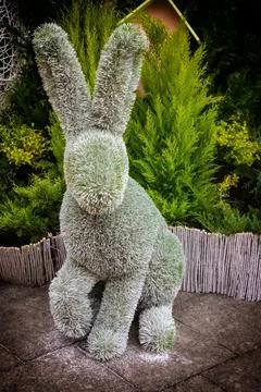 Design Easter decor park installed sculpture rabbit with standing ears vertic Stock Photos