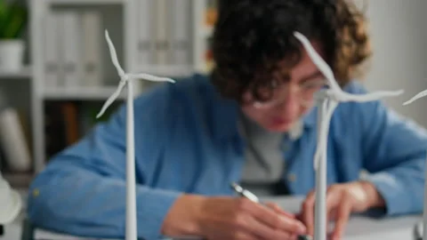 Design Engineer Busily Doing Research Measuring Data on Blueprints Design En Stock Footage 233516256