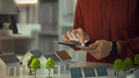 A design engineer holds a digital tablet analyzing electronic data wirelessl Stock Footage 334075567