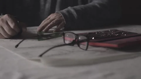 Design Engineer Using Precision Drafting Tools on Blueprint in Moody Studio Stock Footage 341926787