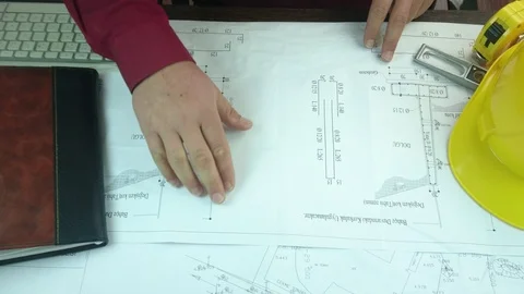 Design engineers discuss the project and make measurements Stock Footage 89938125