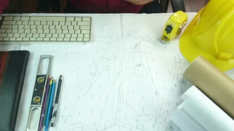 Design engineers discuss the project and make measurements Stock Footage 89939394