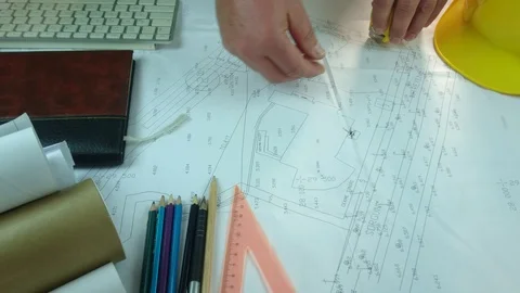Design engineers discuss the project and make measurements Stock Footage 89939821