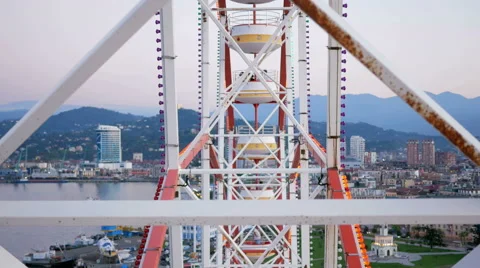 The design of the Ferris wheel with the height of raised booths. The wheel moves Stock Footage 67731456