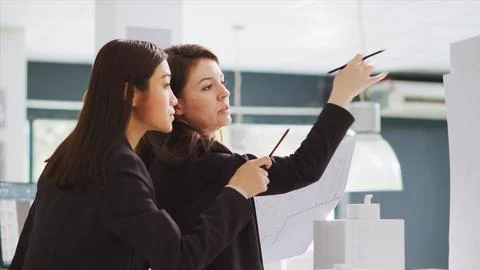 Design group interprets dimensions working in real estate Stockfoto's