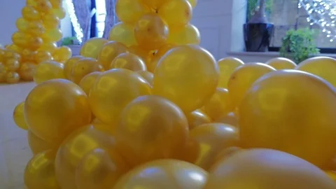 The design of a hall in the yellow balloons. Bunch of colored balloon decoration Stock Footage 72140738