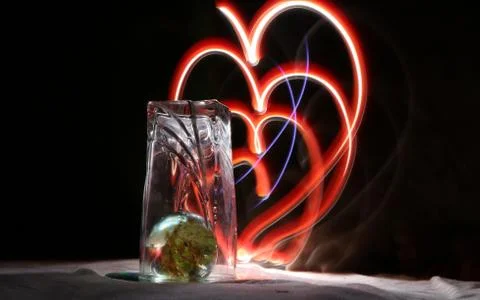 Design love shape using lights Stock Photos