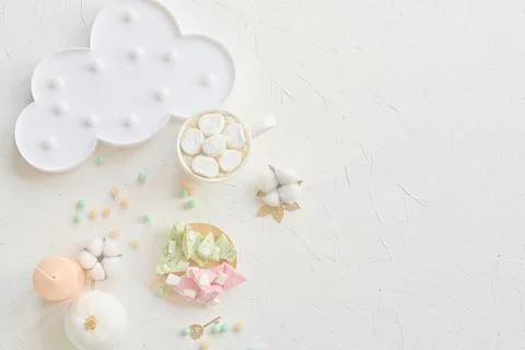 Design a pastel dessert set with clouds and marshmallows for an artistic and Stock Photos