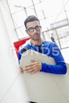 Design professional carrying a drawing board Stock Photos