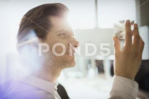 Design professional examining prototype part in office Stock Photos