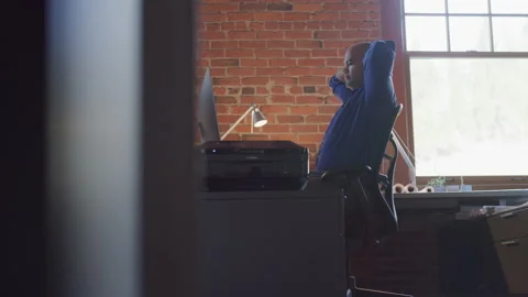 Design Professional Looking at the Computer and Tiredly Putting hands on Head Stock Footage 210219114